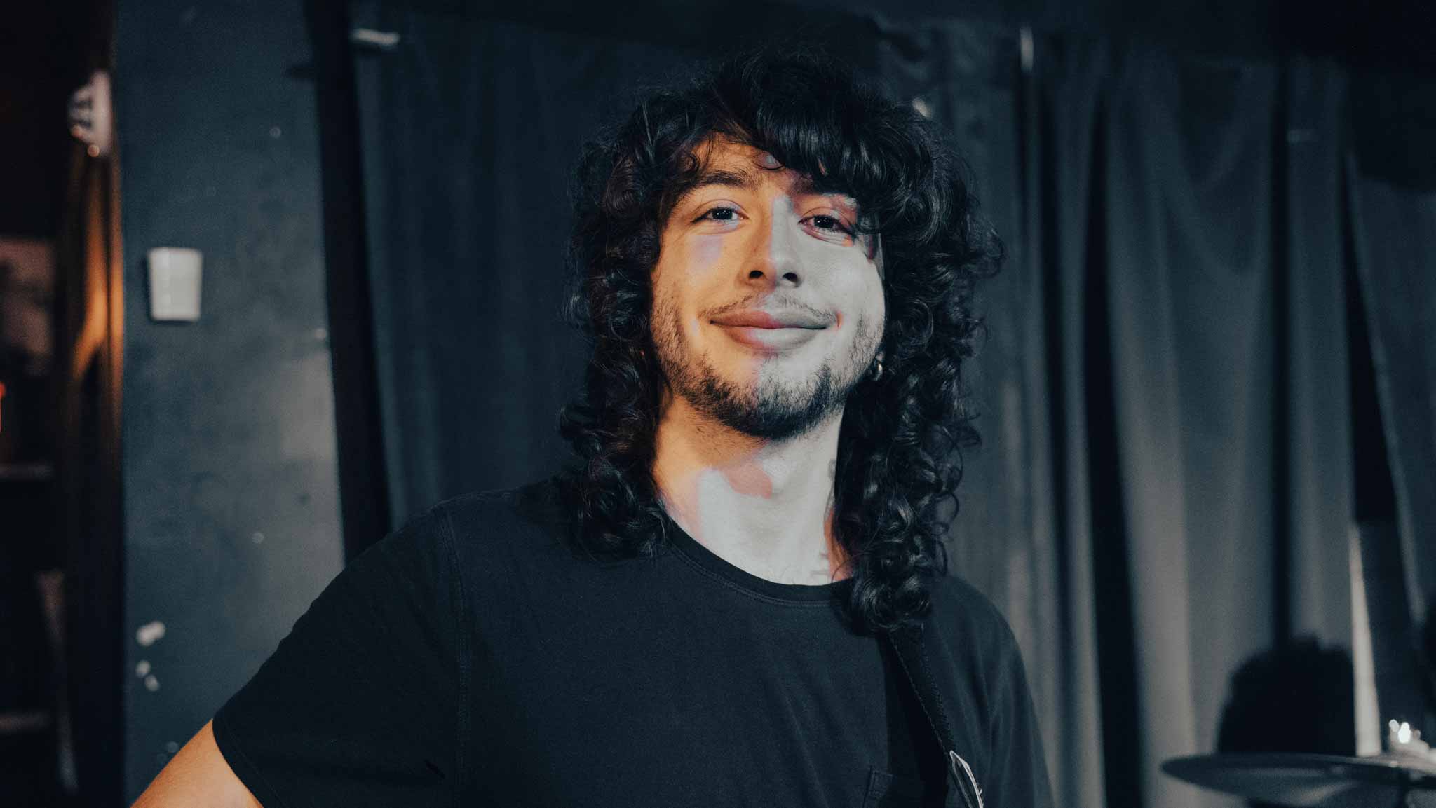 Smiling musician standing onstage